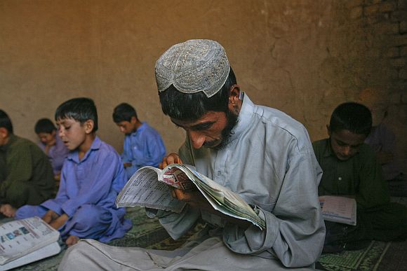 A Pakistani boy learns how to read English at a school on the outskirts of Quetta