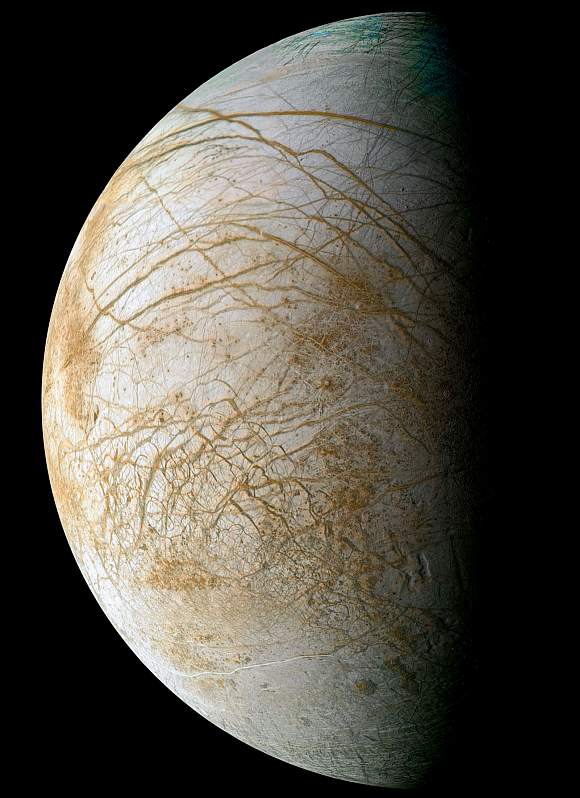 Complex and beautiful patterns adorn the icy surface of Jupiter's moon Europa, as seen in this color image intended to approximate how the satellite might appear to the human eye. Many reddish linear to curvilinear features are observed, some stretching for thousands of kilometers across the surface. The reddish-brown material is a non-ice contaminant that colors Europa's frozen surface.