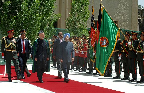 File photo of Dr Singh inspecting a guard of honour with Afghan President Hamid Karzai in Kabul