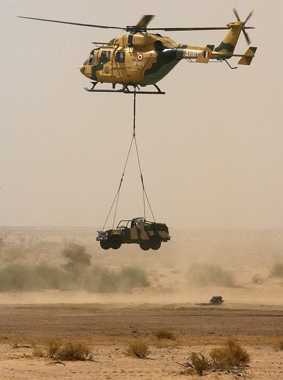 An Indian army jeep is lowered by a helicopter at the Pokharan firing range