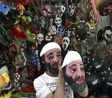 A vendor sells masks of Al Qaeda founder Osama bin Laden