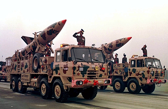 Transporters mounted with India's surface-to-surface Prithvi missiles make their way past a saluting base during the annual Army Day parade in New Delhi