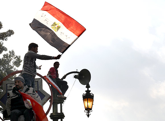 An Egyptian protester waves a flag