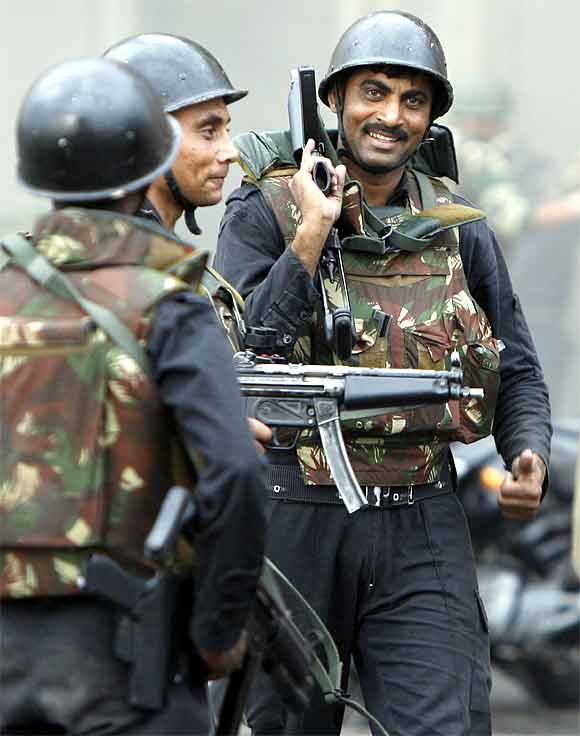 NSG commandos react after a successful operation to dislodge Islamist militants from Taj Mahal hotel in Mumbai November 29, 2008