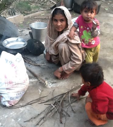 A woman cooks her family's evening meal