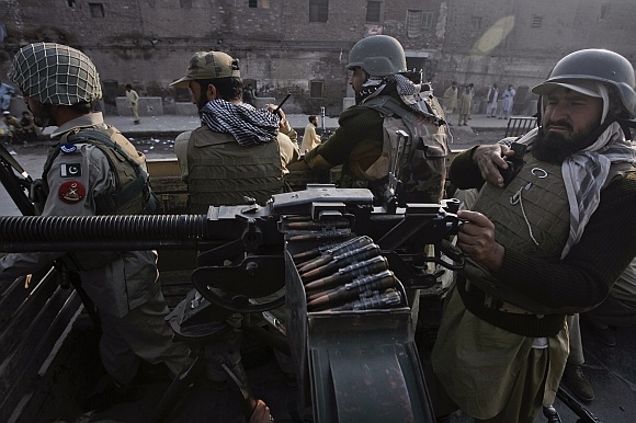 Paramilitary forces patrol the streets of Peshawar, in northwest Pakistan.