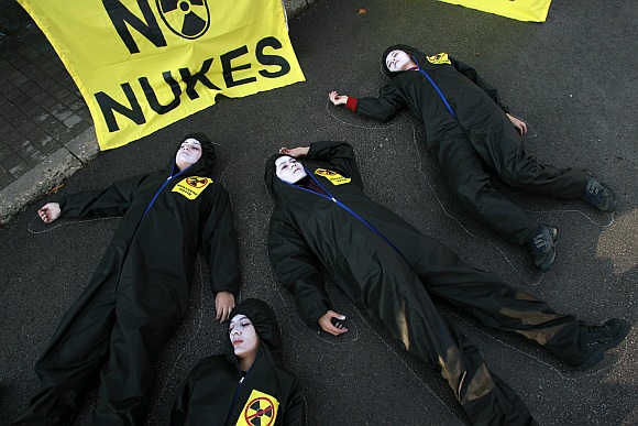 Greenpeace activists play dead in protest.