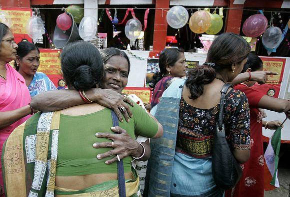 Sex workers participate in an AIDS awareness programme in Kolkata