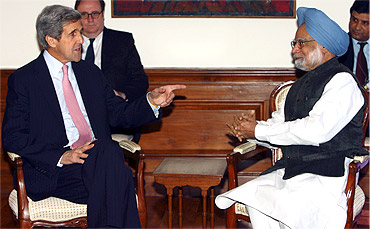 A file photo of US Senator John Kerry with Prime Minister Manmohan Singh