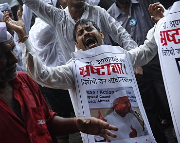 File picture of supporters of Anna Hazare celebrating after the veteran activist ended his anti-corruption fast
