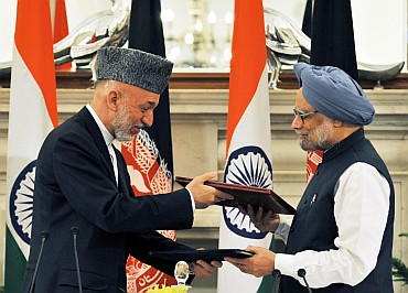 Prime Minister Dr Manmohan Singh and Afghanistan President Hamid Karzai exchanging the singed documents of an agreement on Strategic Partnership