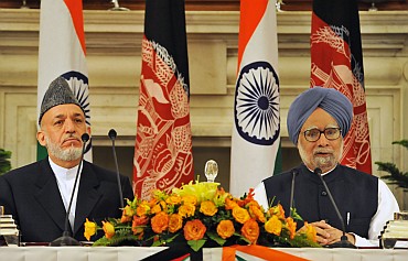 Prime Minister Manmohan Singh with Afghan President Hamid Karzai at a joint press conference