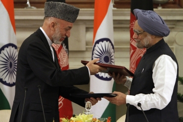 Karzai and Dr Singh exchange documents after signing a joint statement at Hyderabad House in New Delhi