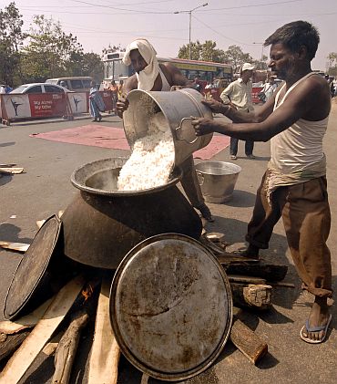 Telangana JAC members prepare food on the road during a protest in Hyderabad