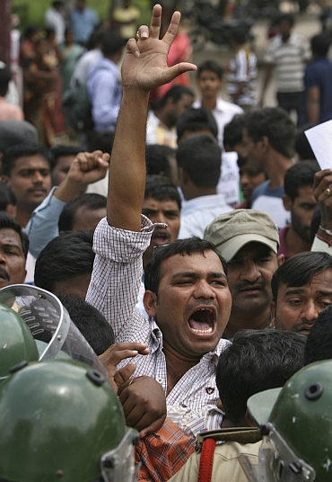 A demonstrator shouts anti-government slogans during a protest demanding statehood for Telangana