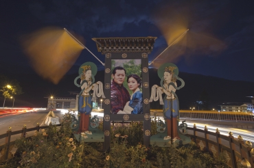 A portrait of Bhutan's King Jigme Khesar Namgyel Wangchuck and his bride Jetsun Pema is seen pictured in a roundabout in capital Thimphu
