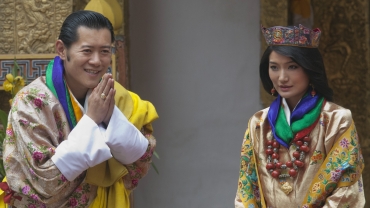 King Jigme Khesar Namgyel Wangchuck greets journalists after his marriage to Queen Jetsun Pema at the Punkaha Dzong in Bhutan's ancient capital Punakha
