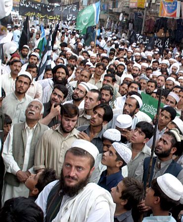 Islamic fundamentalists listening to a sermon at Lahore