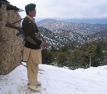 A Pakistani border security force stands guard at a border post along the Pakistan-Afghanistan border in North Waziristan