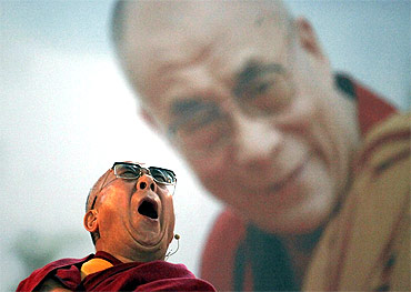 Tibet's exiled spiritual leader the Dalai Lama yawns as he attends a conference