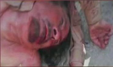 A photograph purporting to show a dead Muammar Gaddafi as show on Libya's Al Ahrar network