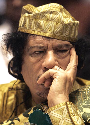 Libyan leader Muammar Gaddafi listens during the opening session of the 12th African Union Summit in Ethiopia's capital Addis Ababa