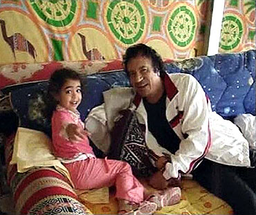 Gaddafi relaxes with his granddaughter in his tent at the Bab al-Aziziya compound in Tripoli