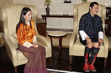 King Jigme Khesar Namgyel Wangchuck and Queen Jetsun Pema sit at the Indira Gandhi international airport