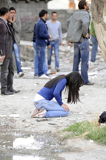 A survivor breaks down in  in Tabanli village near the eastern Turkish city of Van