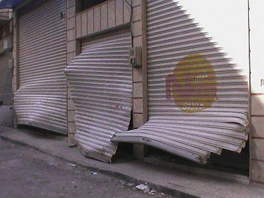 A damaged store is seen in the Bab Sabaa neighbourhood of Homs in Syria