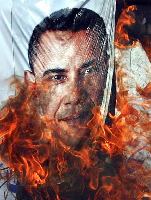 Supporters of the religious political party Sunni Tehreek set ablaze an effigy of U.S. President Barack Obama during an anti-American rally in Hyderabad