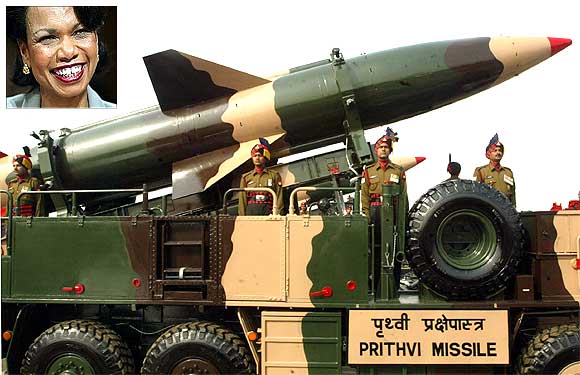 Indian soldiers stand beside a surface-to-surface missile, the Prithvi. Inset: Former top American diplomat Condoleezza Rice