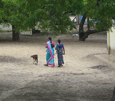 Two Lankan refugees walk inside the Mandapam camp in Ramnathapuram