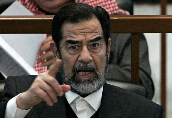 Late Iraqi President Saddam Hussein reacts in court during the Anfal genocide trial in Baghdad in this picture taken on December 21, 2006.