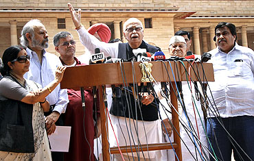 Senior BJP leaders L K Advani, Sushma Swaraj, Nitin Gadkari and others speak to the media outside the Parliament