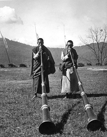 Tibetan monks playing long trumpets at the Festival of Kanchenjunga in Tibet in this April, 1959 picture