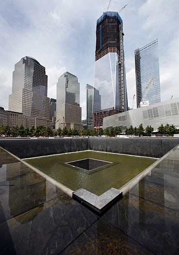 The south pool waterfall is tested as work continues on the National September 11 Memorial and Museum at the World Trade Center site in New York