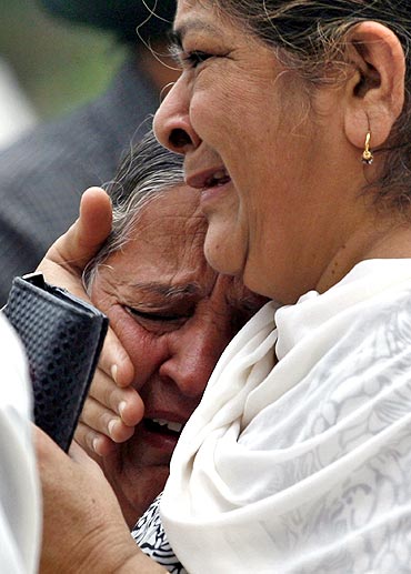Relatives mourn the death of Inder Singh, who was killed in Wednesday's high court bomb blast