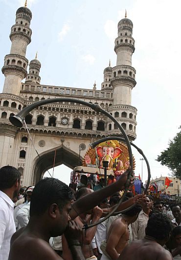A Ganpati immersion procession underway near Charminar in Hyderabad on Sunday