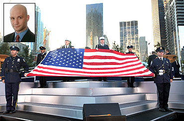 An American flag is unfurled during ceremonies marking the 10th anniversary of the 9/11 attacks on the World Trade Center in New York. Inset: Stephen Tankel