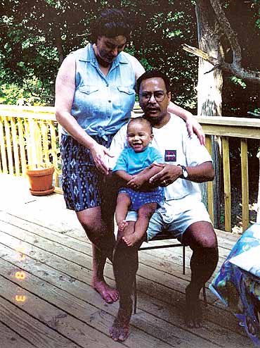 Young Santi with his parents Nancy and Jupiter Yambem