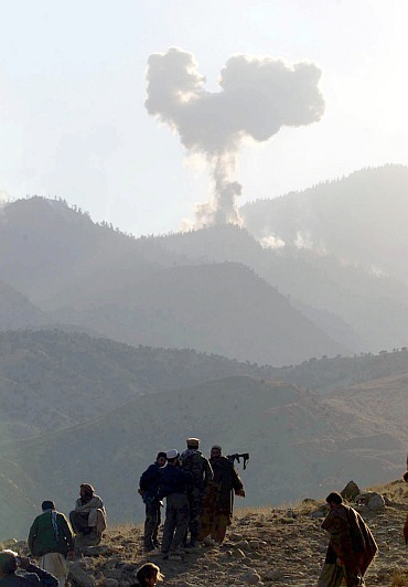 Smoke from United States bombing is seen at a command post in the Tora Bora mountains