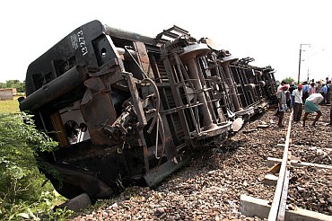 Railway workers at the mishap site