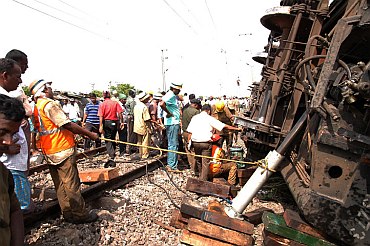Railway authorities with rescue workers at the site