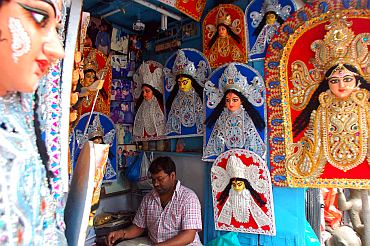 Artists at Kumartuli preparing thermocol decorations for Durga idols and pandals