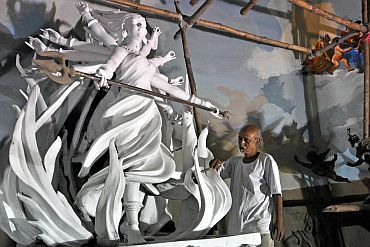 Another idol of Maa Durga being decorated by an artist in Kolkata