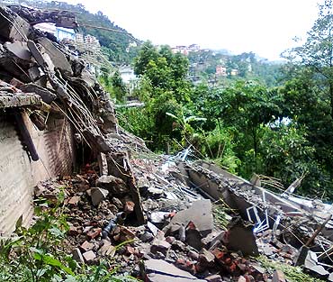 The debris of a residential building in Lumsey in Gangtok