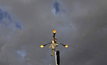 An effigy of Yemen's President Ali Abdullah Saleh is hung on a street lamp by a protester in Sanaa