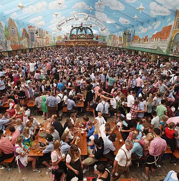 A general view shows a crowded beer tent during the opening day of the Oktoberfest 2011 beer festival at Theresienwiese