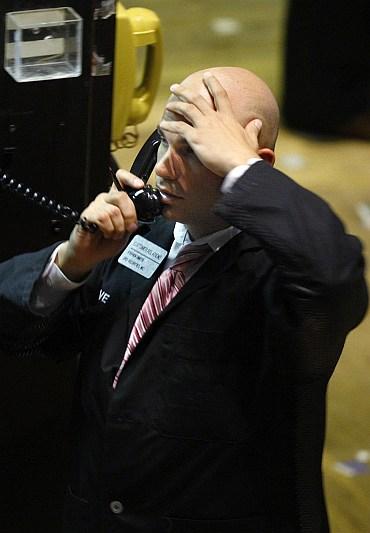 A trader works on the floor of the New York Stock Exchange